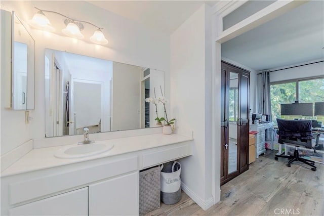 5493 Twin Lakes Dr, Cypress, CA 90630 - bathroom with wood finished floors and vanity