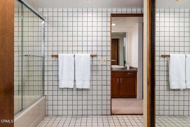 140 Belday Rd, Pasadena, CA 91105 - full bathroom featuring tile walls, vanity, tile patterned flooring, and bath / shower combo with glass door
