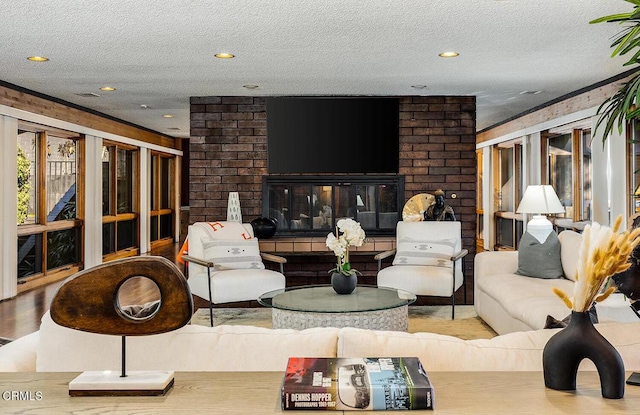 140 Belday Rd, Pasadena, CA 91105 - living room featuring a textured ceiling, brick wall, recessed lighting, and wood finished floors