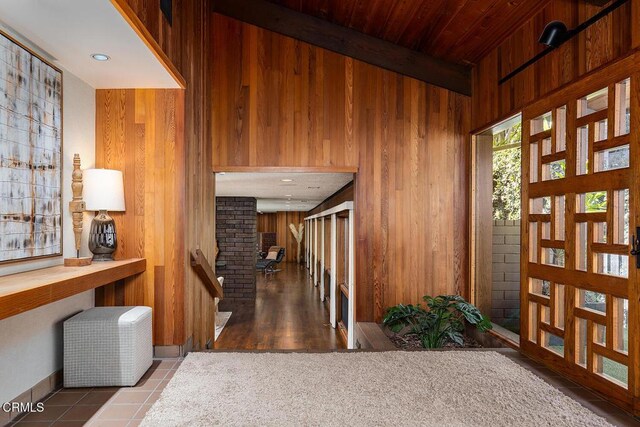 140 Belday Rd, Pasadena, CA 91105 - hallway with wood walls, beamed ceiling, and tile patterned floors