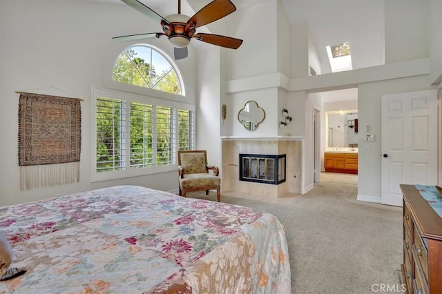 2279 Calle Liseta, San Dimas, CA 91773 - carpeted bedroom featuring a towering ceiling, a fireplace, a skylight, ensuite bathroom, and a ceiling fan