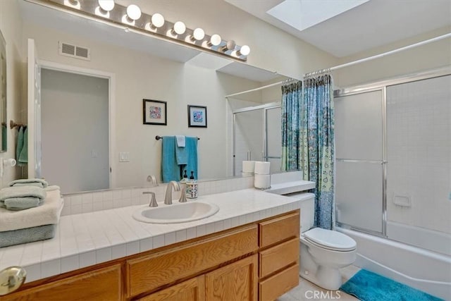 2279 Calle Liseta, San Dimas, CA 91773 - bathroom featuring a skylight, vanity, bath / shower combo with glass door, and tile patterned flooring
