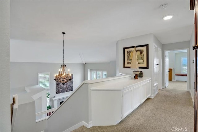 2279 Calle Liseta, San Dimas, CA 91773 - hallway with a chandelier, an upstairs landing, and light colored carpet