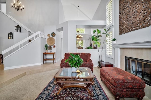 2279 Calle Liseta, San Dimas, CA 91773 - carpeted living area with a chandelier, a towering ceiling, stairs, and a glass covered fireplace