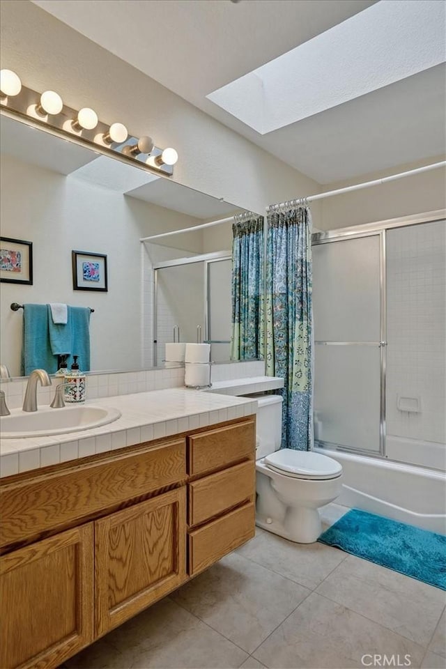2279 Calle Liseta, San Dimas, CA 91773 - bathroom with a skylight, tile patterned floors, vanity, and bath / shower combo with glass door
