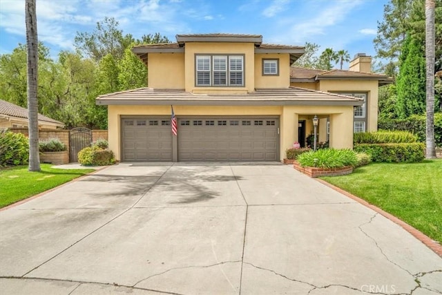 2279 Calle Liseta, San Dimas, CA 91773 - view of front of home featuring an attached garage, a chimney, driveway, and stucco siding