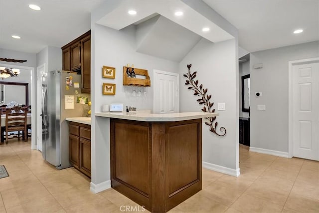 2279 Calle Liseta, San Dimas, CA 91773 - kitchen with freestanding refrigerator, light countertops, recessed lighting, light tile patterned floors, and a peninsula