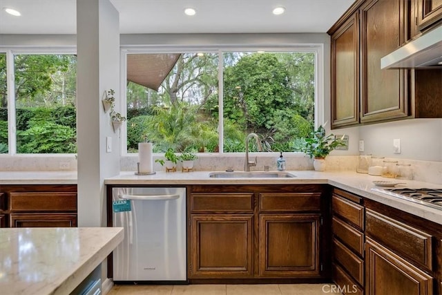2279 Calle Liseta, San Dimas, CA 91773 - kitchen with under cabinet range hood, dishwasher, light tile patterned flooring, light stone counters, and recessed lighting