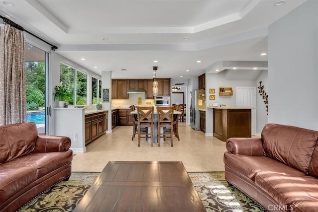 2279 Calle Liseta, San Dimas, CA 91773 - living area featuring a tray ceiling, light tile patterned flooring, and recessed lighting