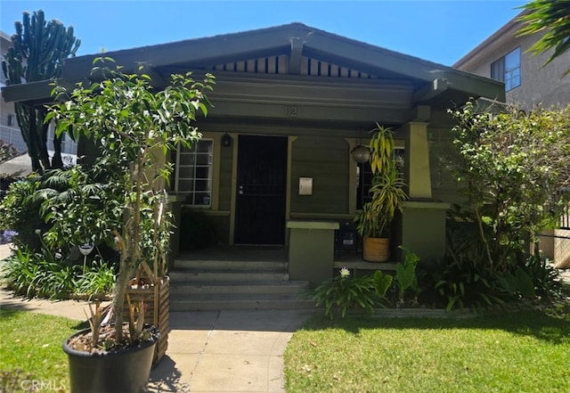1121 Gladys Ave, Long Beach, CA 90804 - view of front of house featuring a front yard and a porch