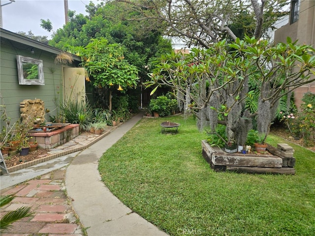 1121 Gladys Ave, Long Beach, CA 90804 - view of grassy yard with an outdoor fire pit