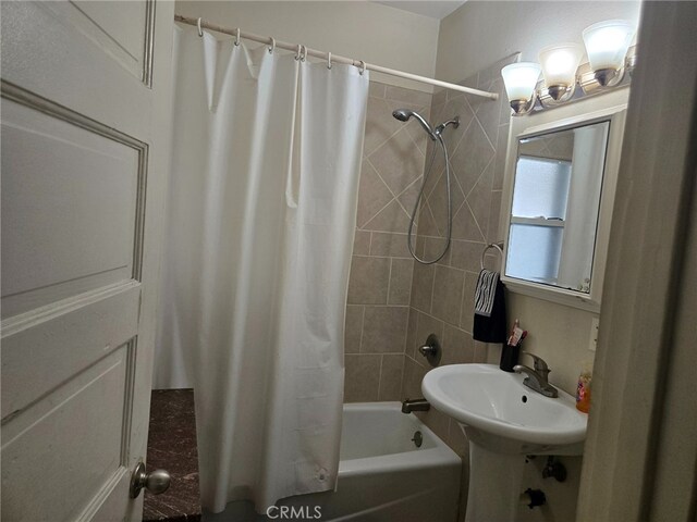 1121 Gladys Ave, Long Beach, CA 90804 - bathroom with shower / bath combo and a sink