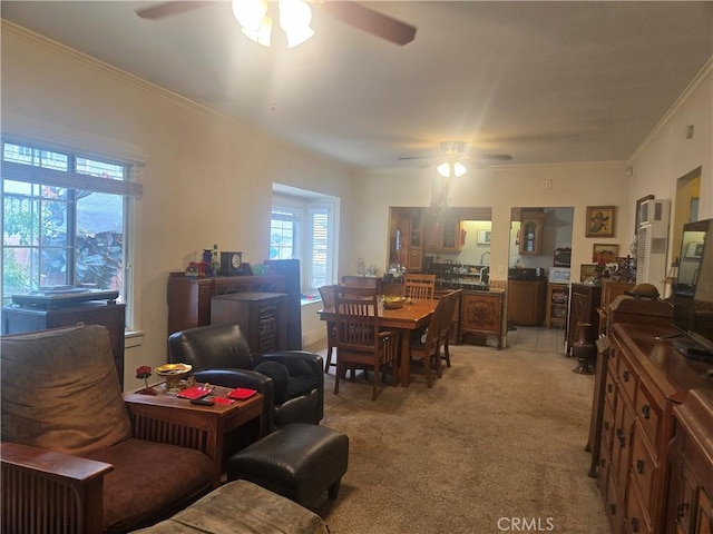 1121 Gladys Ave, Long Beach, CA 90804 - living room featuring ceiling fan, light carpet, and crown molding