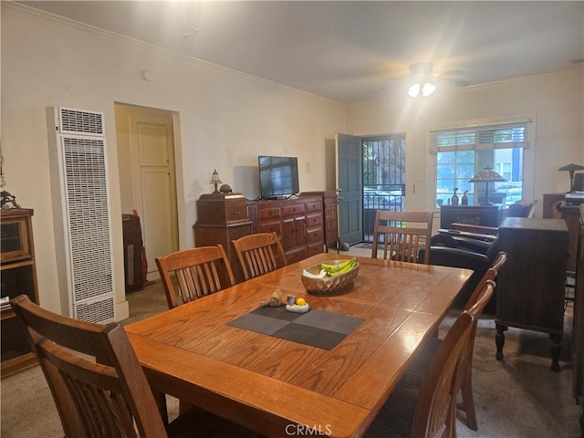 1121 Gladys Ave, Long Beach, CA 90804 - carpeted dining room with a heating unit, ornamental molding, and a ceiling fan