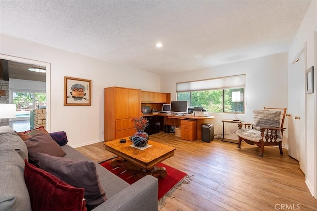 4314 Coronet Dr, Encino, CA 91316 - living room with plenty of natural light, light wood-style floors, recessed lighting, an office area, and a textured ceiling