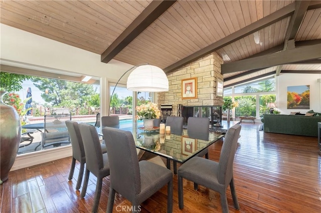 4314 Coronet Dr, Encino, CA 91316 - dining area with wood ceiling, a stone fireplace, and hardwood / wood-style flooring