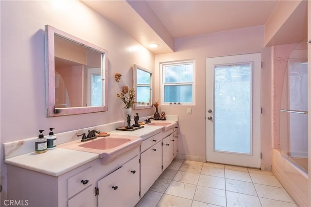 4314 Coronet Dr, Encino, CA 91316 - bathroom with marble finish floors, double vanity, and shower / tub combination