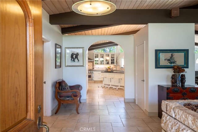 4314 Coronet Dr, Encino, CA 91316 - hall with wood ceiling with exposed beams, arched walkways, and baseboards