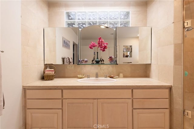 4314 Coronet Dr, Encino, CA 91316 - bathroom featuring vanity, tasteful backsplash, and tile walls