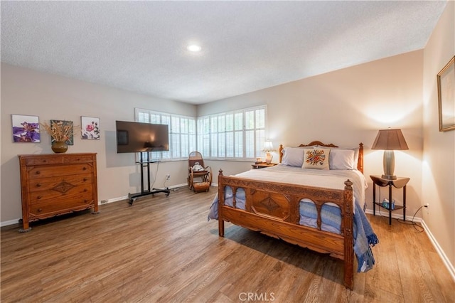 4314 Coronet Dr, Encino, CA 91316 - bedroom with light wood-type flooring, baseboards, a textured ceiling, and recessed lighting