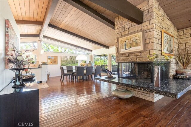 4314 Coronet Dr, Encino, CA 91316 - living room with hardwood / wood-style flooring, plenty of natural light, wood ceiling, a stone fireplace, and baseboards