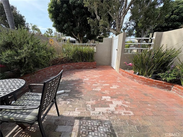 3381 Bandit Cir, Huntington Beach, CA 92649 - view of patio / terrace featuring a gate