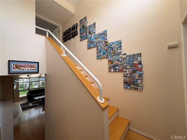 3381 Bandit Cir, Huntington Beach, CA 92649 - stairway featuring wood finished floors and a textured ceiling