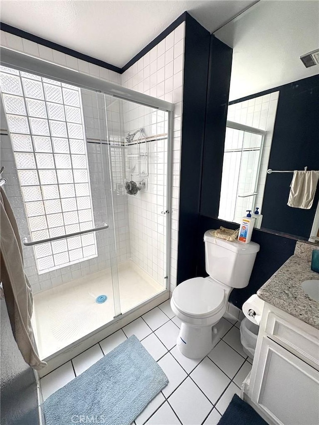 3381 Bandit Cir, Huntington Beach, CA 92649 - bathroom featuring a shower stall, vanity, tile patterned floors, and healthy amount of natural light