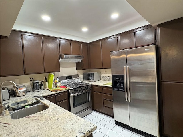 3381 Bandit Cir, Huntington Beach, CA 92649 - kitchen with stainless steel appliances, exhaust hood, dark brown cabinets, light tile patterned floors, and recessed lighting
