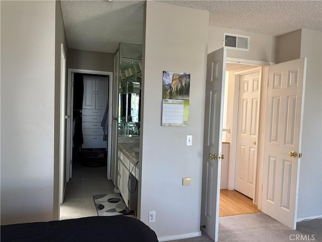 3381 Bandit Cir, Huntington Beach, CA 92649 - bedroom with light colored carpet and a textured ceiling