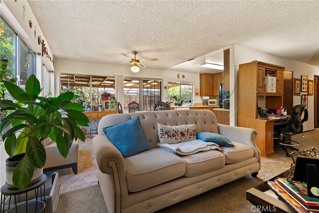 4271 Baggett Dr, Riverside, CA 92505 - living room featuring a textured ceiling, a ceiling fan, light carpet, and an office area