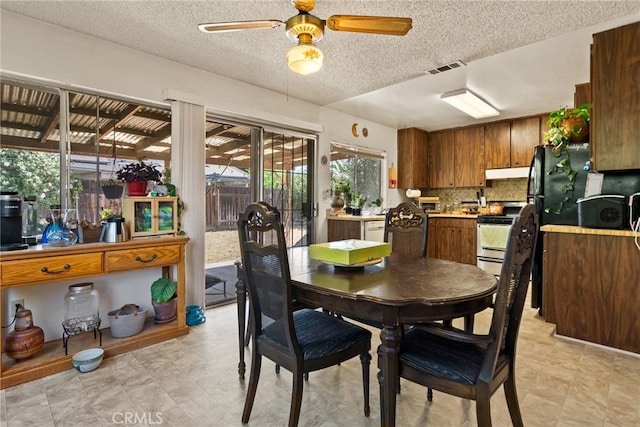 4271 Baggett Dr, Riverside, CA 92505 - dining room with ceiling fan and a textured ceiling