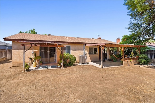 4271 Baggett Dr, Riverside, CA 92505 - rear view of house with a pergola, a patio area, a fenced backyard, and central AC unit