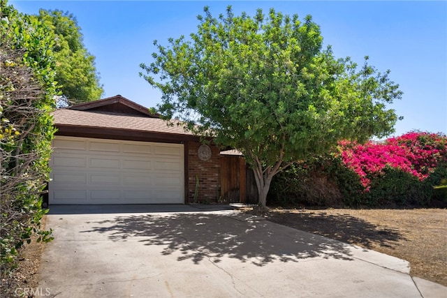4271 Baggett Dr, Riverside, CA 92505 - view of front of house featuring driveway and an attached garage