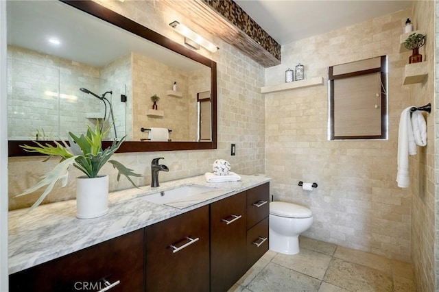 446 W Stocker St Unit 11, Glendale, CA 91202 - full bath with tile walls, vanity, toilet, and a tile shower