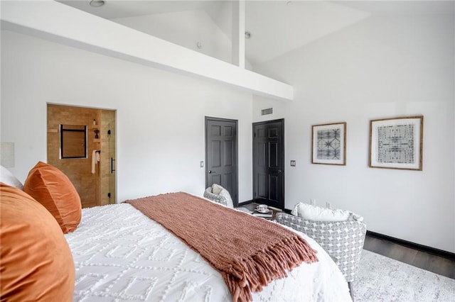 446 W Stocker St Unit 11, Glendale, CA 91202 - bedroom with high vaulted ceiling, wood finished floors, and baseboards