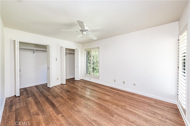 3715 W Birch Ave, Fresno, CA 93711 - unfurnished bedroom with multiple closets, wood finished floors, baseboards, and ceiling fan