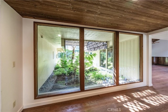 3715 W Birch Ave, Fresno, CA 93711 - doorway featuring wooden ceiling, baseboards, and wood finished floors