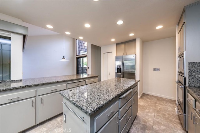 3715 W Birch Ave, Fresno, CA 93711 - kitchen featuring appliances with stainless steel finishes, recessed lighting, a kitchen island, gray cabinets, and stone countertops