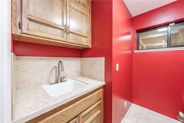 3715 W Birch Ave, Fresno, CA 93711 - bathroom featuring vanity, tasteful backsplash, baseboards, and tile patterned flooring