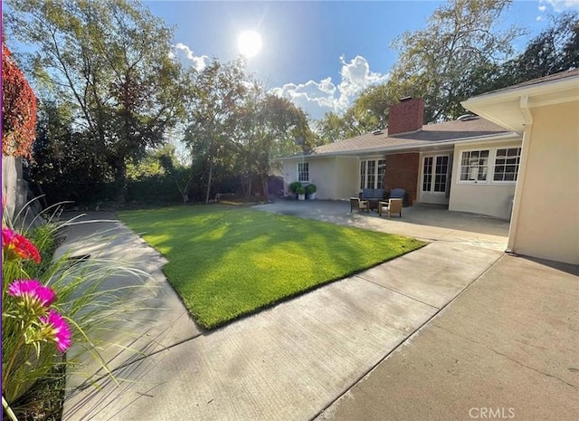 3275 N D St, San Bernardino, CA 92405 - view of grassy yard featuring a patio