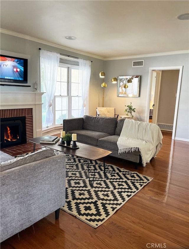 3275 N D St, San Bernardino, CA 92405 - living room with wood finished floors, ornamental molding, a fireplace, and baseboards