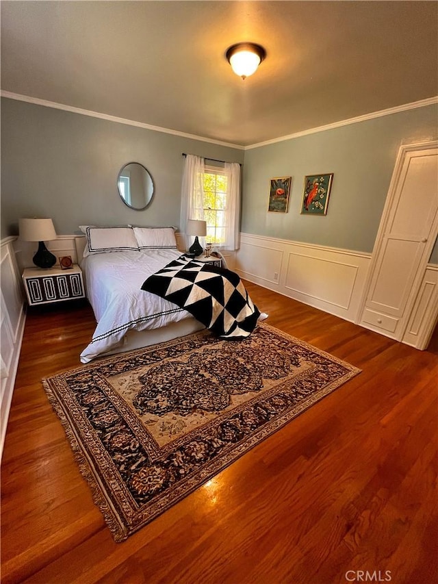 3275 N D St, San Bernardino, CA 92405 - bedroom featuring ornamental molding, wood finished floors, a wainscoted wall, and a decorative wall