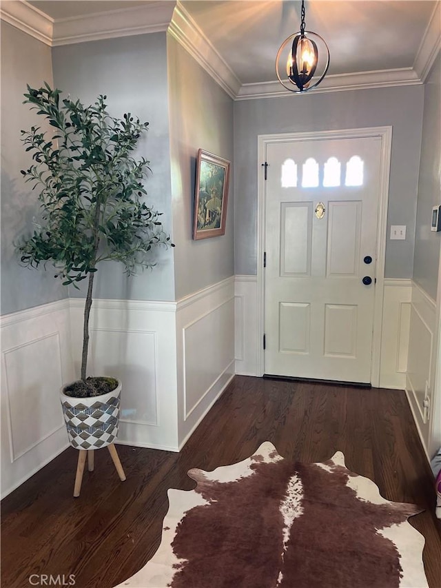 3275 N D St, San Bernardino, CA 92405 - foyer with dark wood-type flooring, a wainscoted wall, crown molding, and a decorative wall