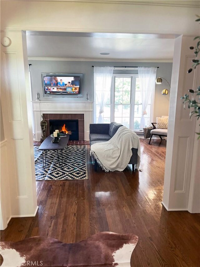 3275 N D St, San Bernardino, CA 92405 - living area featuring ornamental molding, a brick fireplace, and wood finished floors