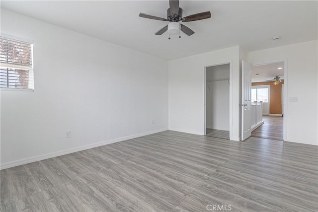 38161 Desert Hawk Dr, Palmdale, CA 93552 - empty room featuring a ceiling fan, wood finished floors, and baseboards