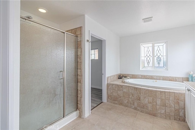 38161 Desert Hawk Dr, Palmdale, CA 93552 - full bath with a shower stall, a garden tub, tile patterned flooring, and vanity