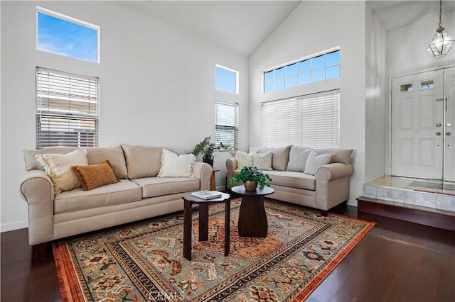 3065 Conestoga Canyon Rd, Palmdale, CA 93550 - living room with high vaulted ceiling, hardwood / wood-style floors, and baseboards
