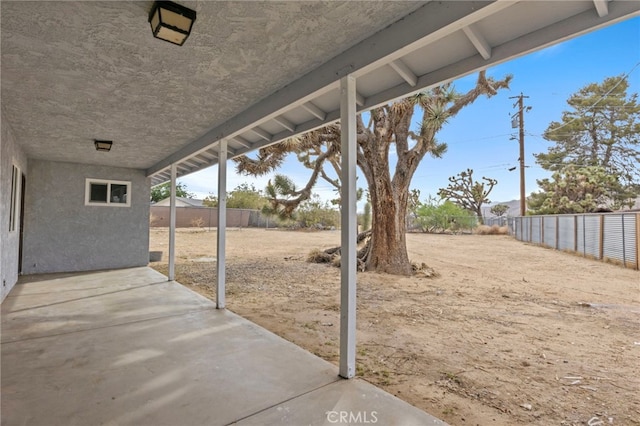 7010 Airway Ave, Yucca Valley, CA 92284 - fenced backyard featuring a patio area