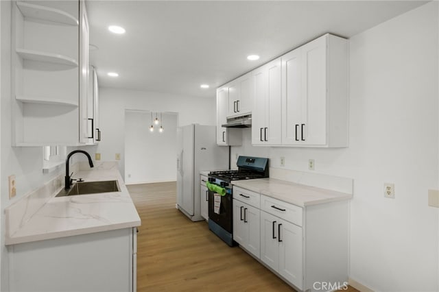 7010 Airway Ave, Yucca Valley, CA 92284 - kitchen featuring gas range oven, a sink, under cabinet range hood, open shelves, and recessed lighting